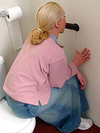 Find-Best-Videos.com presents: Blonde girl Jamie sits on the toilet and blows a black gloryhole dong